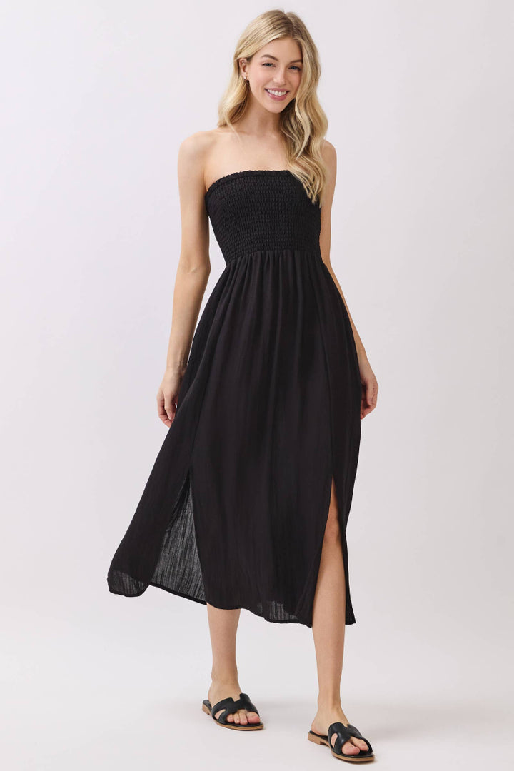 Woman wearing a black strapless dress on a white background
