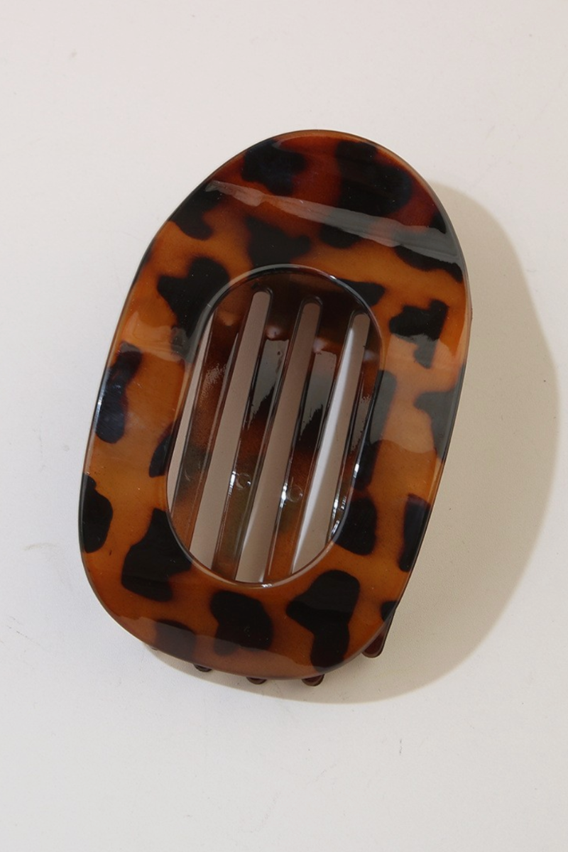 Tortoiseshell patterned hair clip on a white background