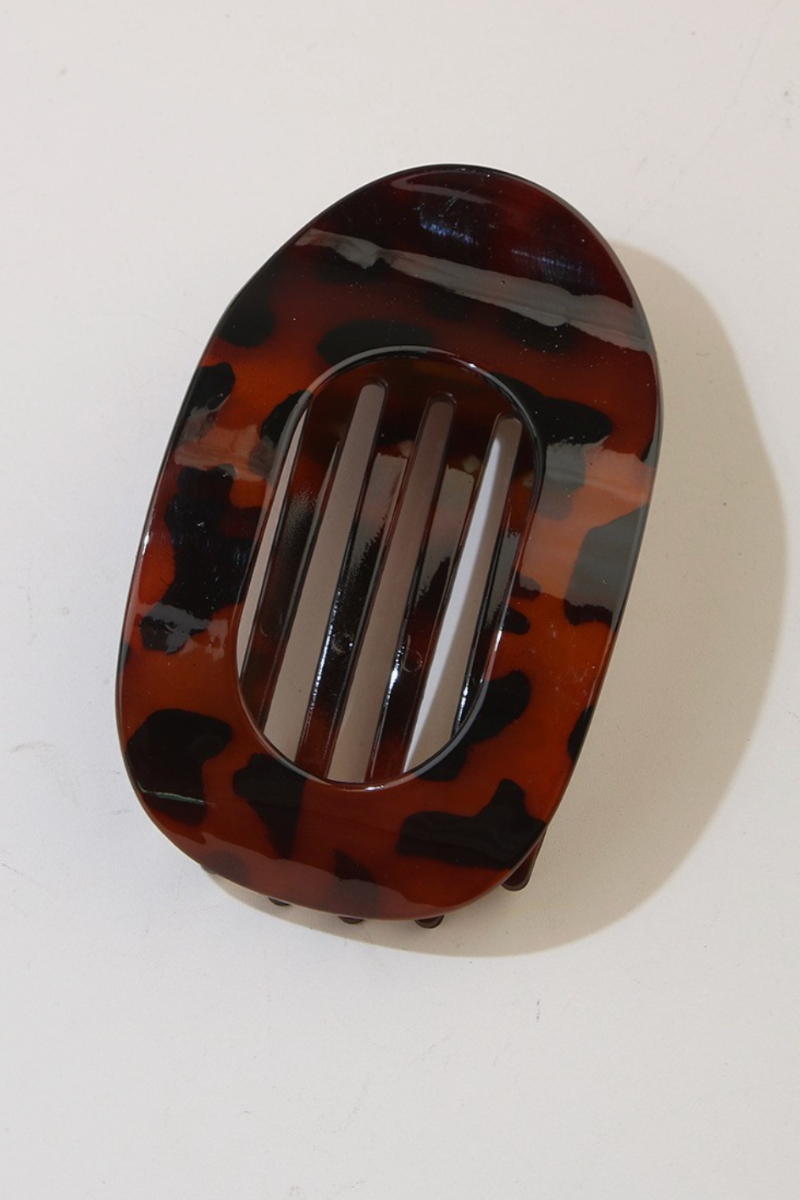 Tortoiseshell patterned hair clip on a white background