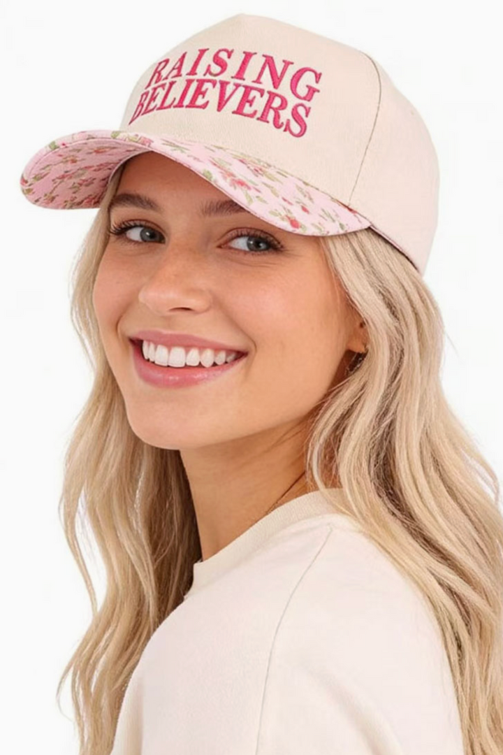 Woman wearing a beige cap with &