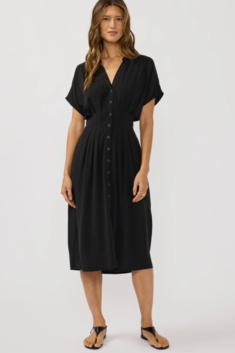 Woman wearing a black dress on a white background